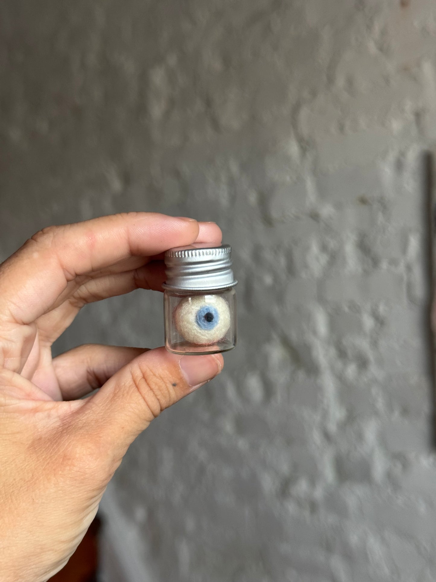 Mini felted eyeball in jar