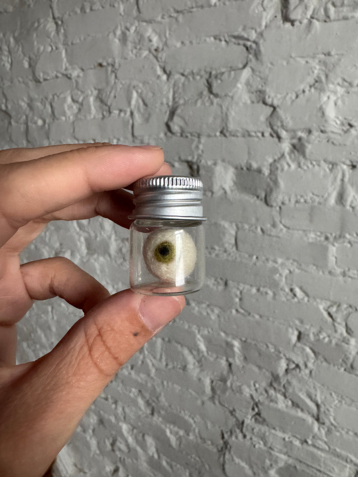 Mini needle felted eyeball in jar