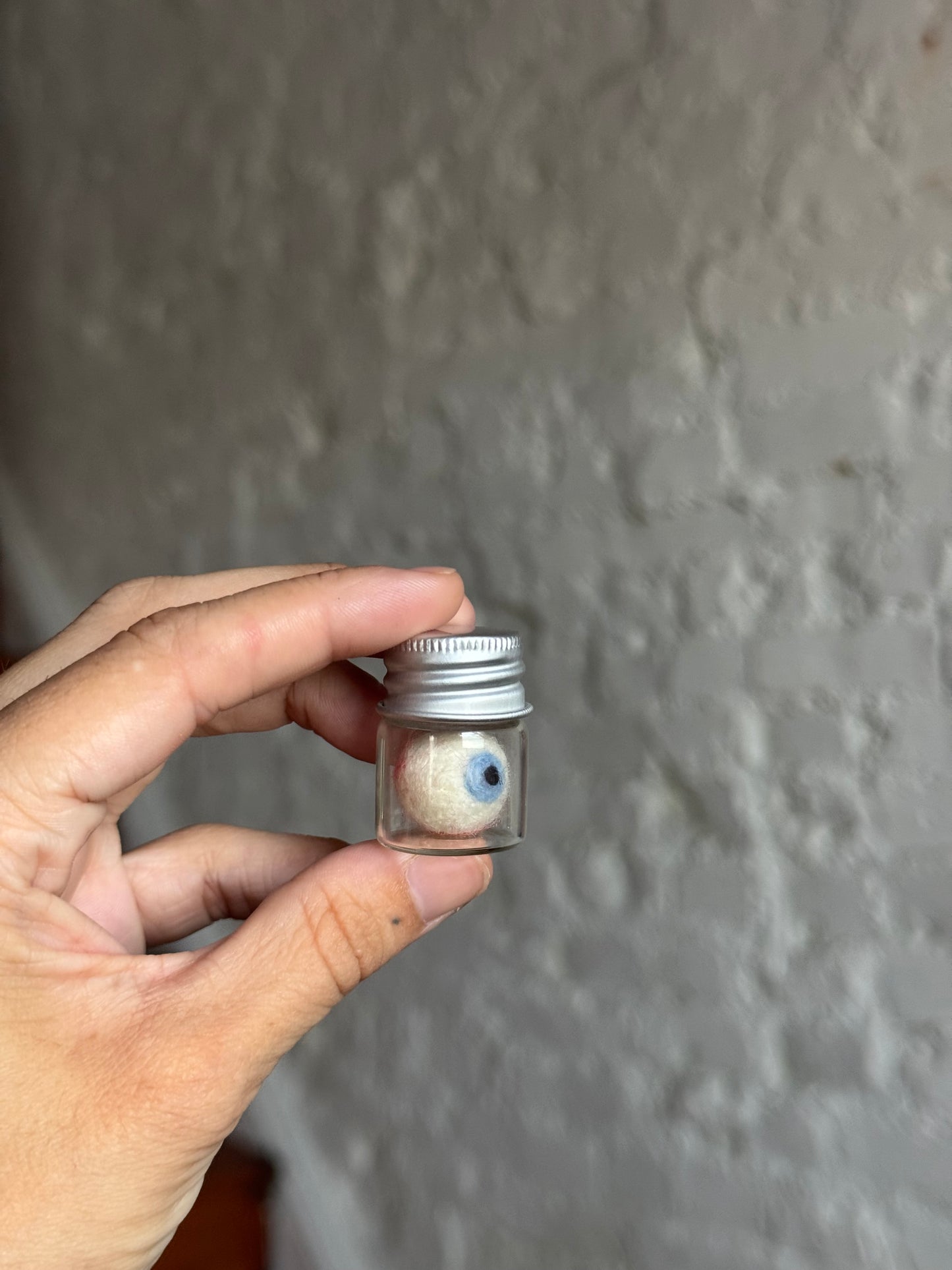 Mini felted eyeball in jar