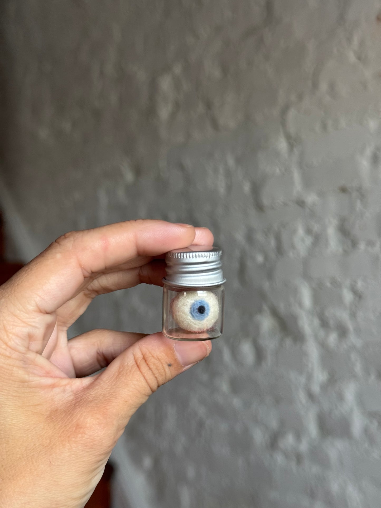 Mini felted eyeball in jar