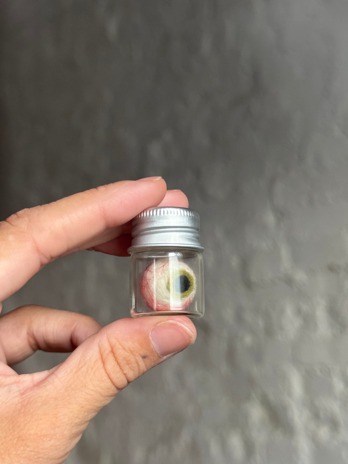 Mini felted eyeball in jar