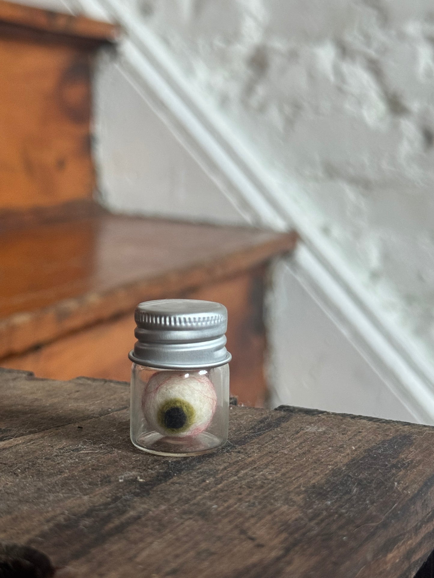 Mini felted eyeball in jar