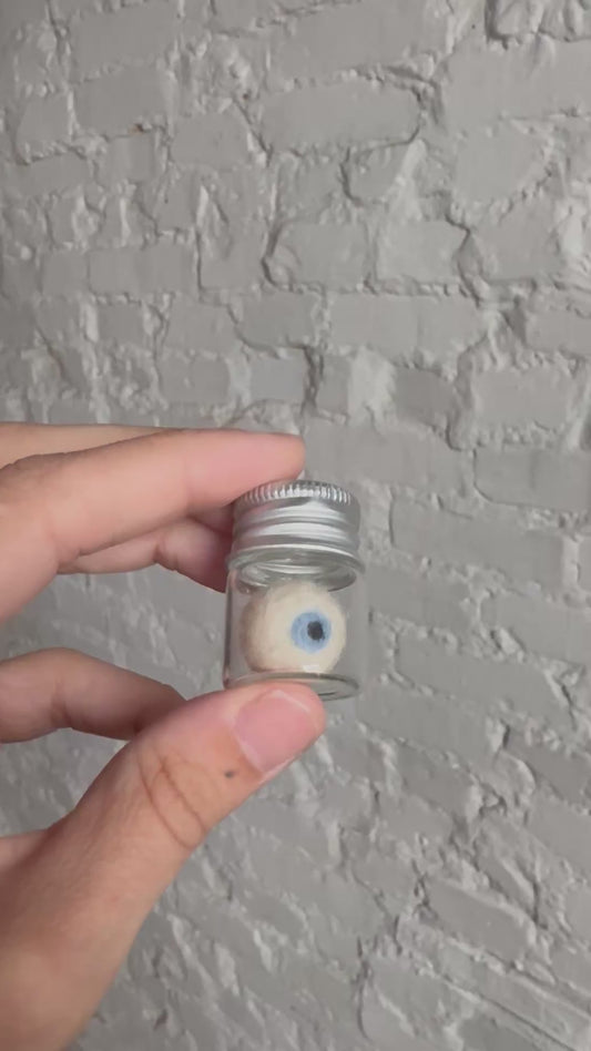 Mini needle felted eyeball in jar